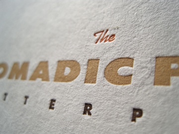 The Nomadic Press logo